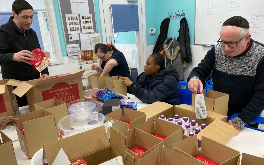 Members pack Pesach treats for the Army